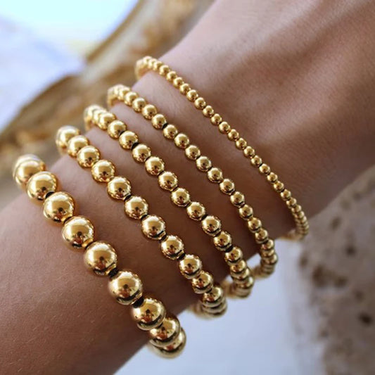 Ines - Pulsera de bolas doradas apilada